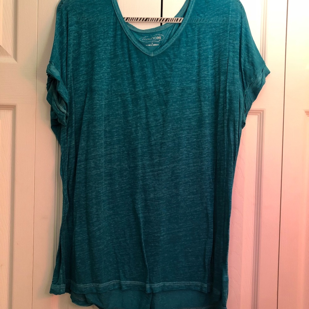 Blue Maurice’s tee.